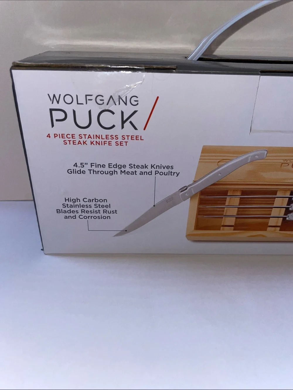 NIB Wolfgang Puck 4-Piece Stainless Steel Steak Knife Set.
